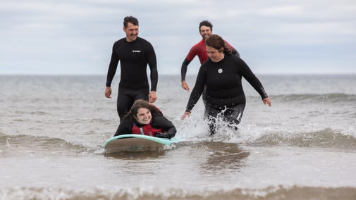 Podcast team recording an episode about adaptive surfing at Sandhaven Beach, South Shields, Tyne & Wear